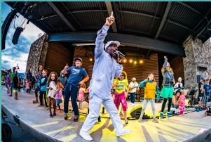 Pato banton on stage with children