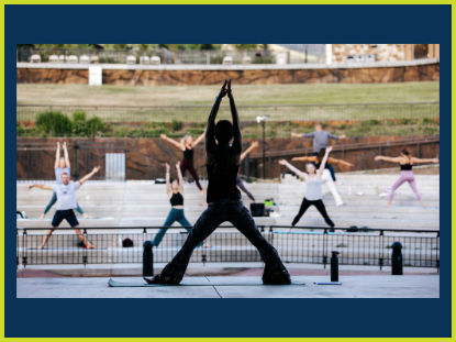 Person doing yoga on the stage at the Dillon Amphitheater